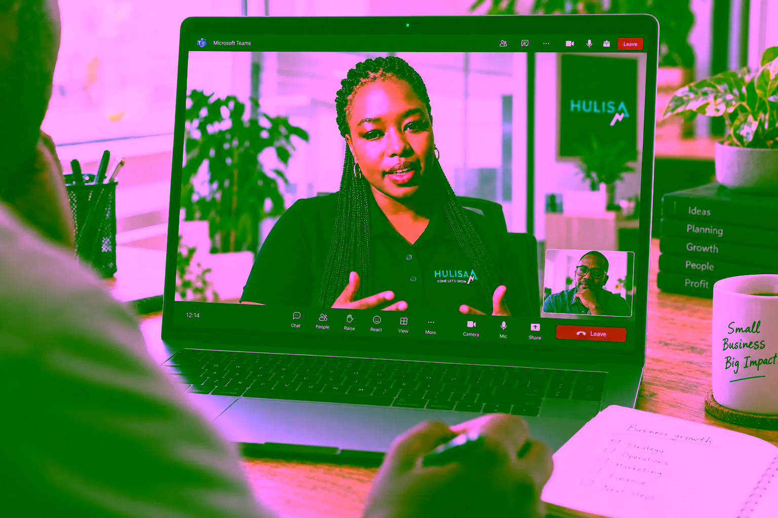 Illustrative Teams discussion with Taetso in Hulisa merchandise, focused on a client’s laptop screen